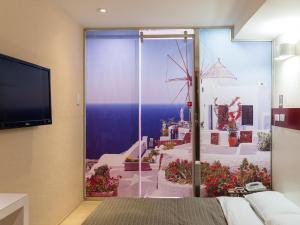 TV a/nebo společenská místnost v ubytování E-House Hotel