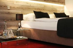 Postel nebo postele na pokoji v ubytování Hotel & Garden U Holubů