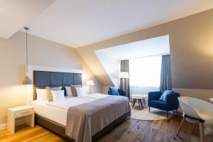 Postel nebo postele na pokoji v ubytování Hotel Birke, Ringhotel Kiel