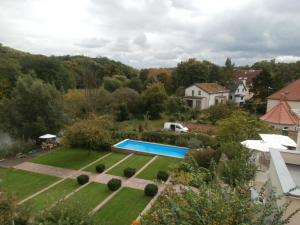 an aerial view of a garden with a swimming pool at Ferienwohnung Saaleblick in Halle an der Saale