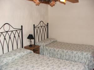 Tempat tidur dalam kamar di Mirador Los Cotos