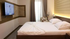 Postel nebo postele na pokoji v ubytování Hotel Admiral + 37 fotografií