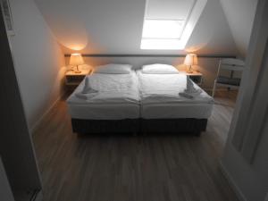 Postel nebo postele na pokoji v ubytování Haus Südstrand 09, Panoramameerblick