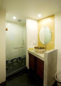a bathroom with a sink and a mirror at Korbua House in Bangkok +52 photos