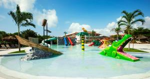 a water park with a water slide and slides at Grand Palladium Imbassaí Resort & Spa - All Inclusive in Imbassai