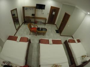 an overhead view of a room with a bed and a table at Happy​​ Family Guesthouse in Kampot +30 photos