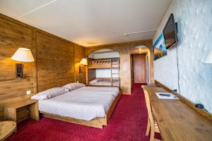Postel nebo postele na pokoji v ubytování Hotel Central Résidence