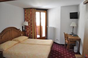 Postel nebo postele na pokoji v ubytování Hotel Central Résidence
