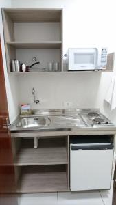 Kuchyň nebo kuchyňský kout v ubytování Hotel Premium Flat Ourinhos