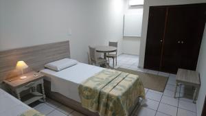 Postel nebo postele na pokoji v ubytování Hotel Premium Flat Ourinhos