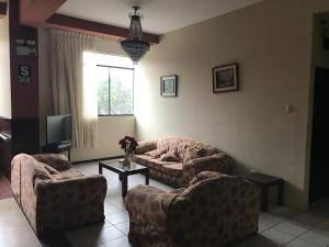 Posezení v ubytování Hostal La Cascada
