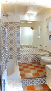 a bathroom with a shower and a toilet and a sink at Maison De La Tour in Antibes