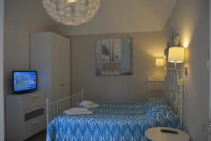 Postel nebo postele na pokoji v ubytování B&B La Casita
