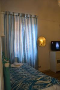 Postel nebo postele na pokoji v ubytování B&B La Casita