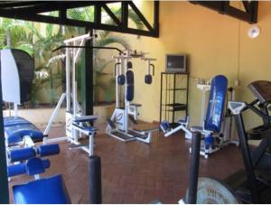 a gym with several exercise equipment in a room at Mariá Plaza Hotel in Araçatuba