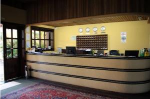 a lobby with a counter in a building at Mariá Plaza Hotel in Araçatuba +38 photos