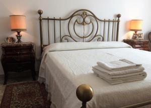 Posteľ alebo postele v izbe v ubytovaní B&B Pergolesi