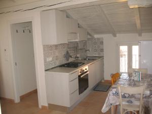 Virtuvė arba virtuvėlė apgyvendinimo įstaigoje Casa Mozart