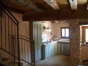 a kitchen with a sink and a stove at b&b casamia in Molina