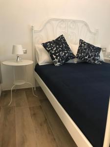 Postel nebo postele na pokoji v ubytování B&B Quasi in centro