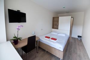 Postel nebo postele na pokoji v ubytování Bella Jūrmala Hotel