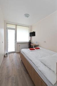 Postel nebo postele na pokoji v ubytování Bella Jūrmala Hotel