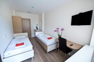 Postel nebo postele na pokoji v ubytování Bella Jūrmala Hotel