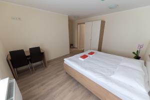 Postel nebo postele na pokoji v ubytování Bella Jūrmala Hotel