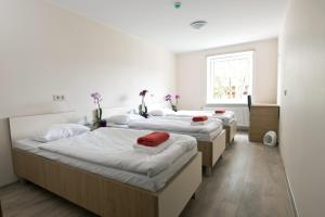 Postel nebo postele na pokoji v ubytování Bella Jūrmala Hotel