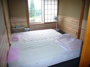 Postel nebo postele na pokoji v ubytování Futago Cabin