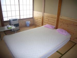 Postel nebo postele na pokoji v ubytování Futago Cabin