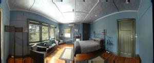 Ένα ή περισσότερα κρεβάτια σε δωμάτιο στο Oakdene Vineyards Guesthouse