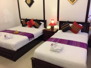 Cama o camas de una habitación en Vientiane SP Hotel