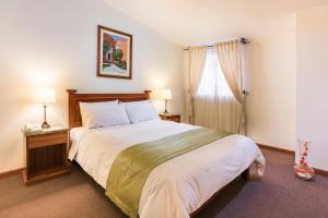 a bedroom with a large bed and a window at Natura Inn Hotel in Arequipa +30 photos