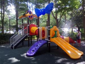 a playground with a slide in a park at Nice Guanxi in Guanxi