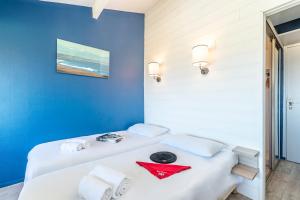 Ein Bett oder Betten in einem Zimmer der Unterkunft Village Vacances Azureva Anglet