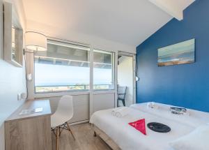 Ein Bett oder Betten in einem Zimmer der Unterkunft Village Vacances Azureva Anglet
