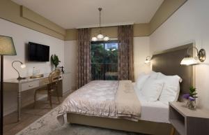 Letto o letti in una camera di Shtarkman Erna Boutique Hotel Nahariya