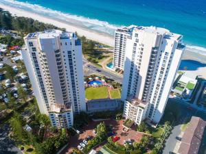 an overhead view of two tall buildings next to the beach at Xanadu Resort in Gold Coast