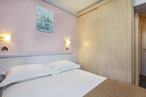 Ein Bett oder Betten in einem Zimmer der Unterkunft Hotel Plavi Plava Laguna
