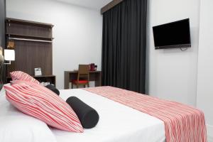 Postel nebo postele na pokoji v ubytování Itaca Artemisa by Soho Boutique