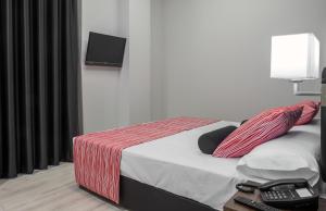 Postel nebo postele na pokoji v ubytování Itaca Artemisa by Soho Boutique
