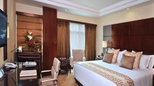 Postel nebo postele na pokoji v ubytování SkyCity Hotel Gurgaon + 37 fotografií