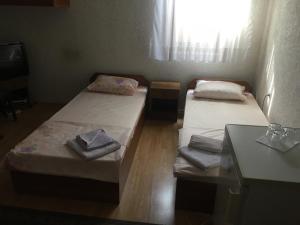 מיטה או מיטות בחדר ב-Bujtina (Pension) Oltas