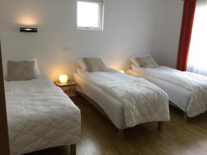 מיטה או מיטות בחדר ב-Dagpol