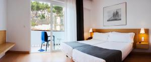 Posteľ alebo postele v izbe v ubytovaní Gran Hotel Reymar 4 Sup
