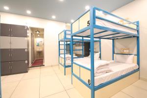 a blue and white bunk bed in a room at Blue Beds Hostel in Jaipur