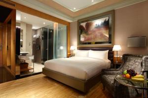 Giường trong phòng chung tại Hotel Eclat Taipei