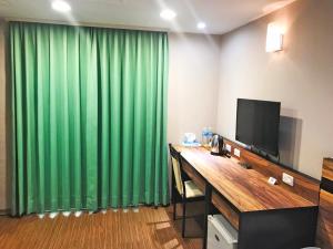 TV/trung tâm giải trí tại 鼎立安商務旅館 Dinglian Hotel
