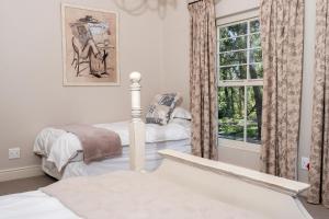 Krevet ili kreveti u jedinici u objektu Franschhoek Rose Cottages